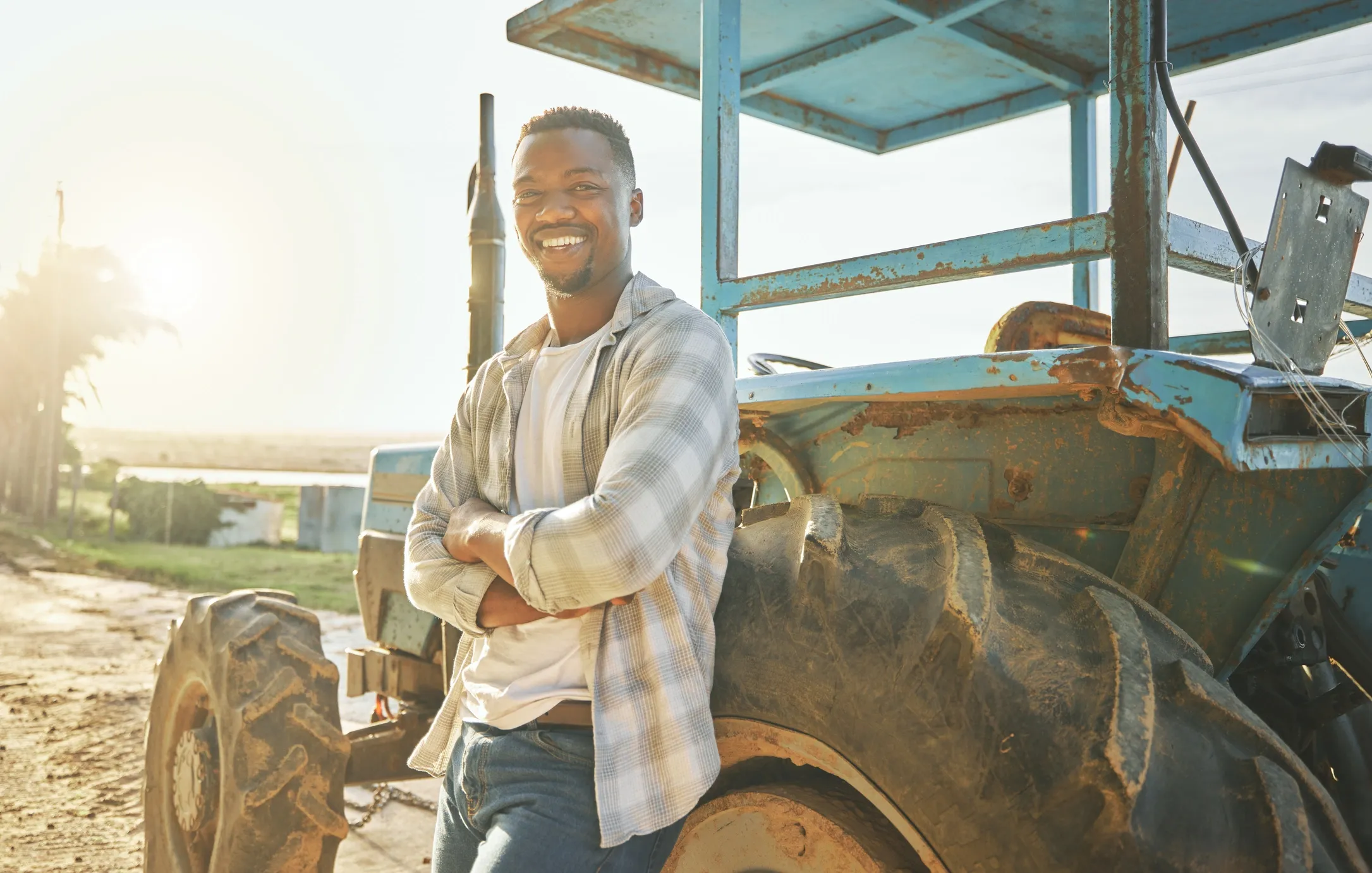 Farmer with tractor in field